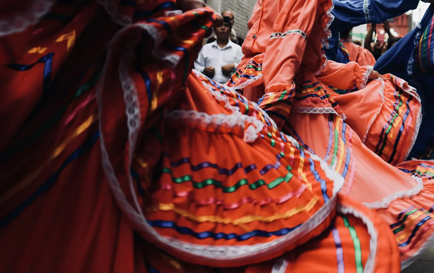 A flamenco dancer in a ruffled dress mid-movement